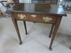 Antique oak georgian side table with single drawer on tapering cabriole legs.