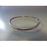 Silver bangle inset with brilliant cut CZs