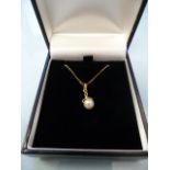 Boxed 14K yellow gold 6.7mm cultured pearl pendant and a 14K chain (20" long), gross weight 2.7g