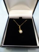 Boxed 14K yellow gold 6.7mm cultured pearl pendant and a 14K chain (20" long), gross weight 2.7g