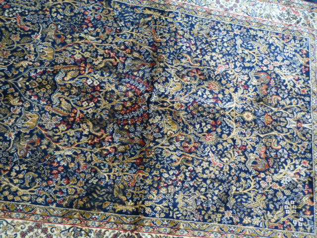 Blue ground carpet with all over floral detailing on a cream border - Image 2 of 4