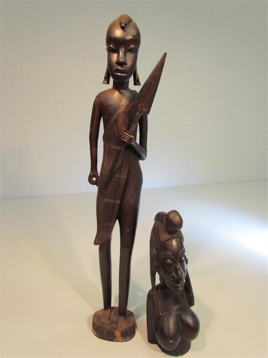 Two African statues carved in ebony coloured hardwood - one tribal warrior with spear. The other a