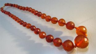 Single Graduated string of faceted Baltic Amber (tested) beads 19.5inch long. The small stones are