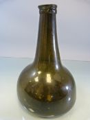 An Early english Green wine bottle of onion form c.1700 ('Breast Bottle') Hand Carved rim with