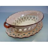 Creamware Chestnut basket with matching plate. Hand Pierced decoration. Decorated in a red and