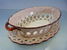 Creamware Chestnut basket with matching plate. Hand Pierced decoration. Decorated in a red and