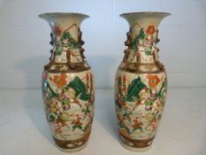 Pair of Japanese Guanyao style vases with everted rims. Enamel overlay painted scenes of battle.