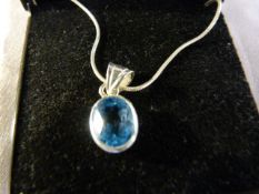 Silver Oval approx 11mm x 8.9mm wide pale Blue set pendant and hung from a 16" Fine Brazilian link