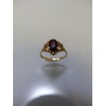 9ct gold ladies dress ring with Ruby coloured stone in decorative mount