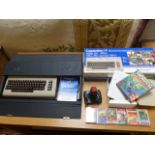 Commodore 64 Microcomputer and games with joystick. Comes with original box and carry case for the