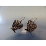 Pair of silver earrings in the form of the wings of world peace