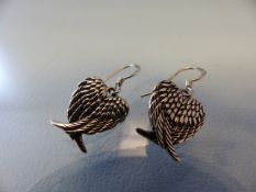 Pair of silver earrings in the form of the wings of world peace