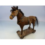 German Pull-Along Toy horse with real horse hair. Metal cast wheels c.1890.