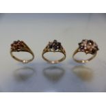 Three 9ct ladies gold rings for repair or scrap each ring missing one stone (total weight 7g)