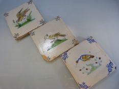 Set of three Dutch Polychrome tiles decorated with birds. C.1700 Minor chips to outer edges.