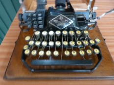 An oak cased 8 Blick Vintage Typewriter 'Cheapside London'