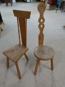 Two carved African Tripod high back chairs.