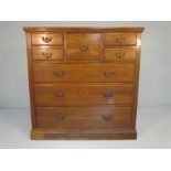 An Oak Chest of Drawers with five short drawers along with further three graduated drawers below