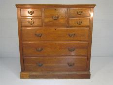 An Oak Chest of Drawers with five short drawers along with further three graduated drawers below