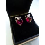 Pair of white gold heart-shaped ruby and diamond earrings