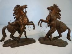 COUSTOU - Pair of large Bronze Marley Horses with attendants on naturalistic bases. Signed COUSTOU