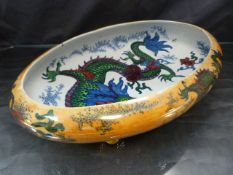 Bursley Ware Dragon lustre water bowl designed by Frederick Rhead, of compressed form on four