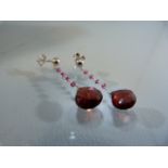 Pair of white gold and garnet drop earrings