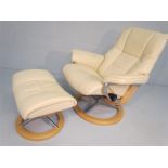 White leather easy chair and footstool