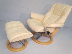 White leather easy chair and footstool