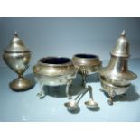 Silver table items to include a pair of salts with Blue glass inners and two spoons and two pepper