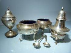 Silver table items to include a pair of salts with Blue glass inners and two spoons and two pepper