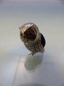 Silver owl pin cushion with glass eyes