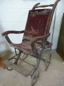Victorian Wooden, metal and cloth Perambulator. The backrest swinging both ways to allow the child