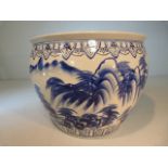 Large Chinese Blue and white fishbowl of large proportion. Decorated exterior of mountainous scenes,