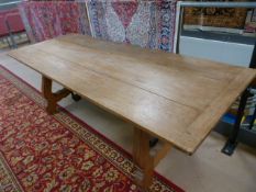 Large handmade dining room table with cast iron supports under