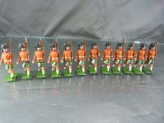 Set of twelve Britains military lead figures, all with movable arms, complete with rifles.