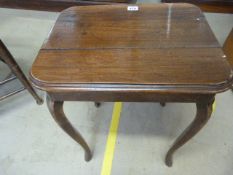 Edwardian Oak side table with sabre legs.