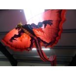 Large Chinese dragon kite with tail and wings.
