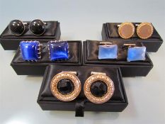 Five pairs of silver cuff links in presentation boxes