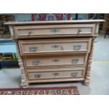 Ornate chest of pine drawers. Turned pillar supports to sides. Top drawer with fitted compartments