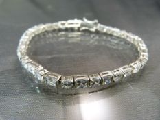 Silver (925) Tennis Bracelet approx 7" long and set with alternate round and square CZ stones approx