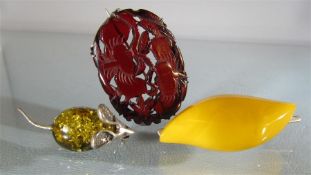 Three amber brooches - 1) Butterscotch Amber approx 17.85mm x 44.6mm wide bar brooch. 2) Silver
