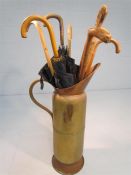 Large copper jug with selection of vintage walking sticks and umbrellas