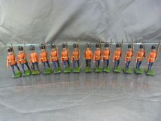 Set of fourteen Britains military lead figures , hand painted all with movable arms and weapons