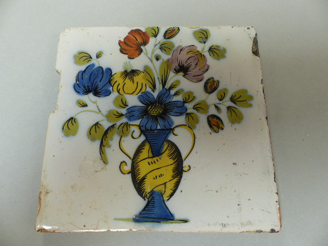 Four Delftware tiles - 1) Decorated in Polychrome colours depicting a vase of flowers. 2) An Early - Image 9 of 10