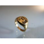 WITHDRAWN:9ct Gold signet ring with a seal depicting an eagles head and a stag (total weight