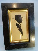 19th Century unsigned Silhouette of a suited Gentleman wearing a top hat. Mounted in an ebonised