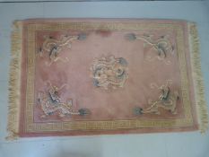 Chinese Pink ground carpet decorated with dragons 190 x 125 cm approx