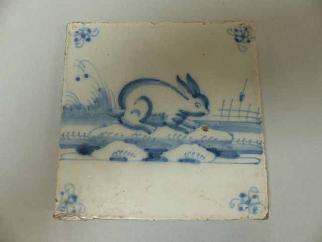 Four Delftware tiles - 1) Decorated in Polychrome colours depicting a vase of flowers. 2) An Early - Image 3 of 10