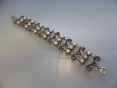 Silver marcasite and freshwater pearl bracelet in a filigree style